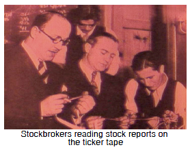 Stockbrokers reading stock reports